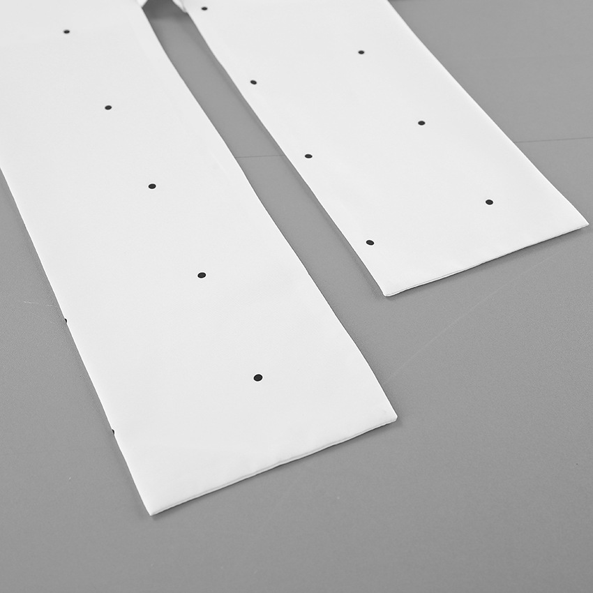 Chemisier sans manches à pois et col montant avec lien dans le dos