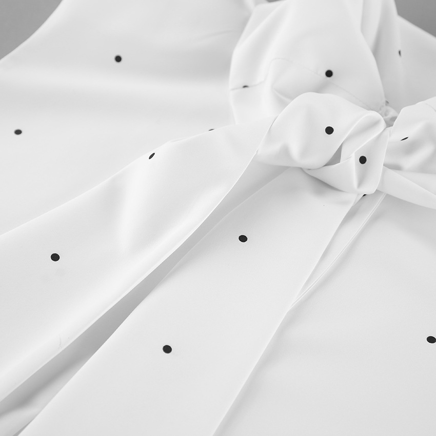 Chemisier sans manches à pois et col montant avec lien dans le dos