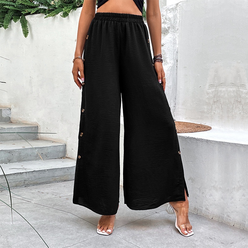 Pantalon palazzo noir à jambes larges et boutons latéraux