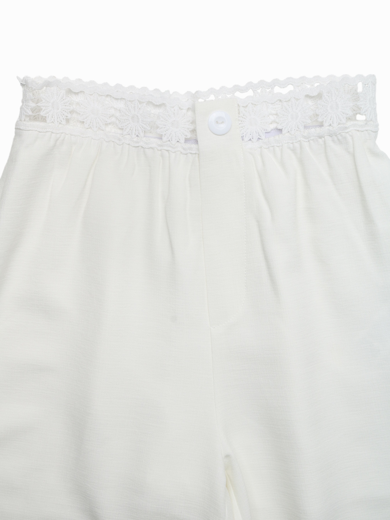 Pantaloni a gamba larga a vita alta con bordo all'uncinetto.
