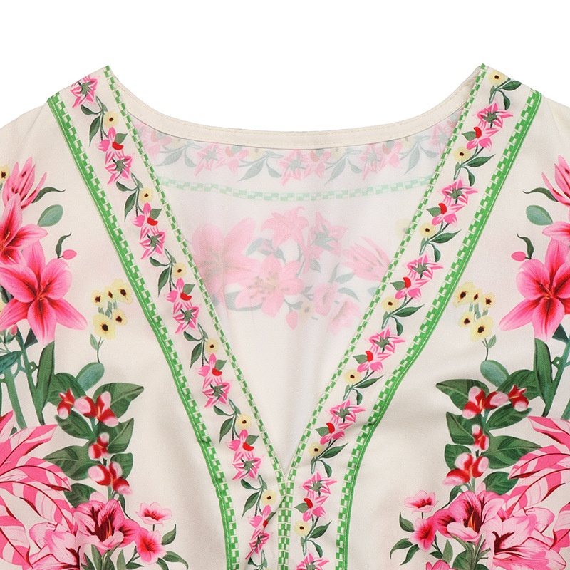 Robe midi élégante à col en V et manches bouffantes, ornée d'un imprimé floral