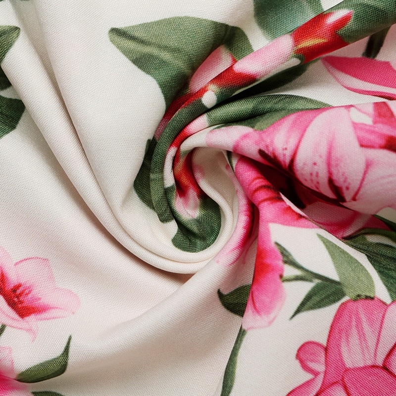 Robe midi élégante à col en V et manches bouffantes, ornée d'un imprimé floral