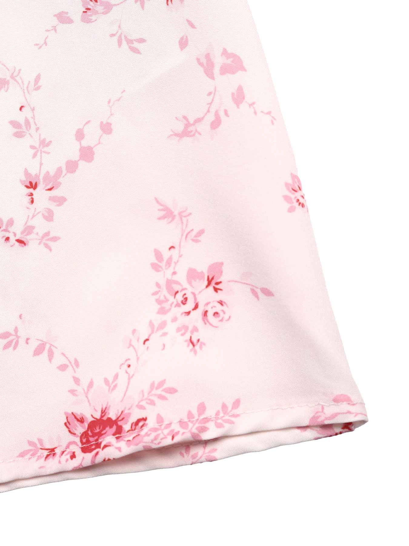 Vestido midi rosa con volantes y lazo frontal con estampado floral