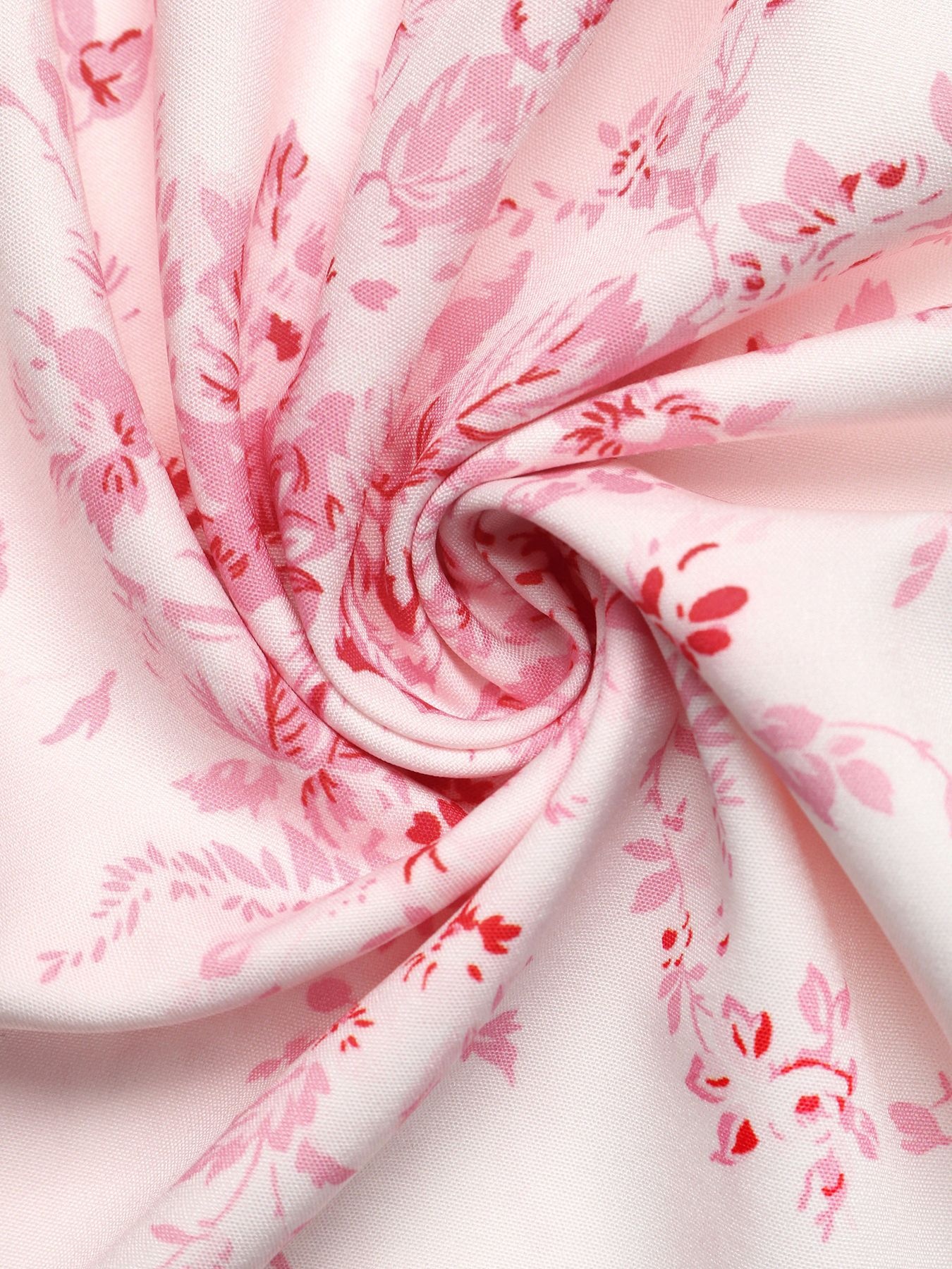 Vestido midi rosa con volantes y lazo frontal con estampado floral