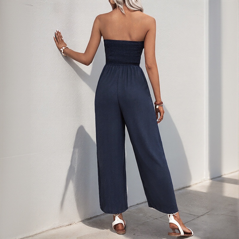 Combinaison bustier bleu marine à jambes larges et nœud papillon sur le devant