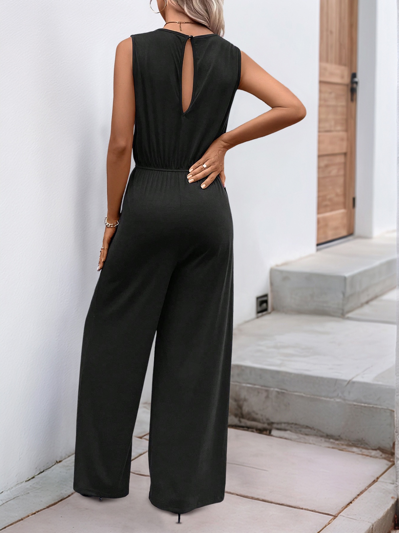 Combinaison sans manches à jambes larges et poches pour femme