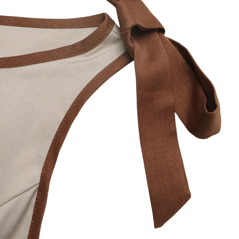 Mono de pierna ancha color beige, confeccionado en mezcla de lino, con tirantes anudados.