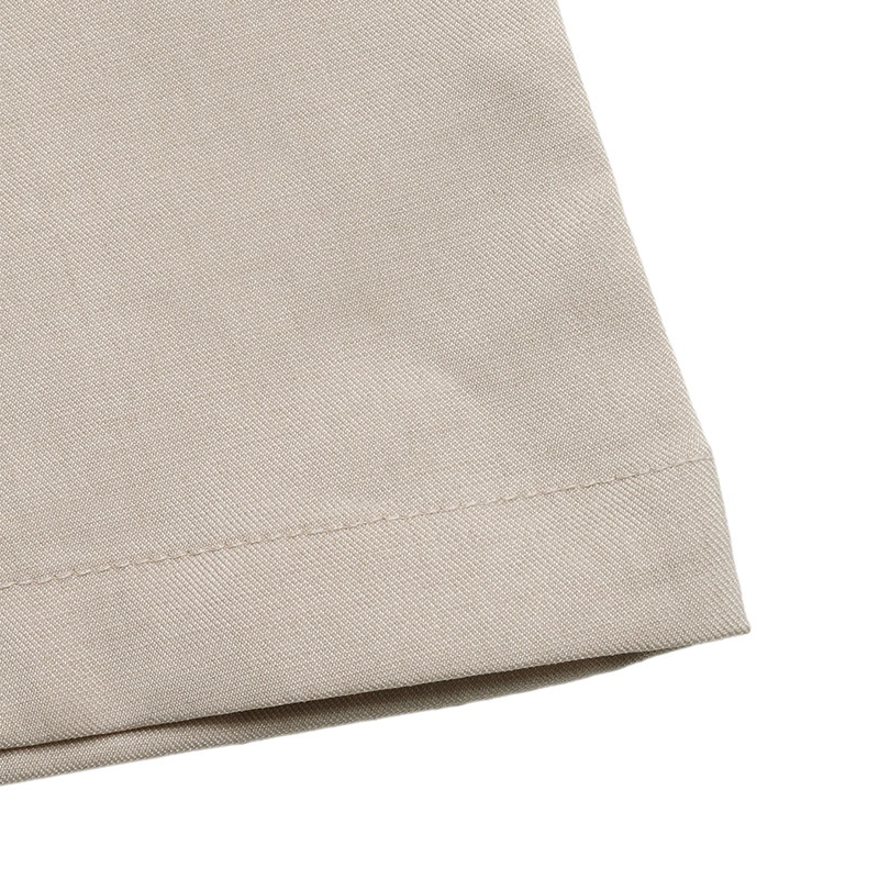 Mono de pierna ancha color beige, confeccionado en mezcla de lino, con tirantes anudados.