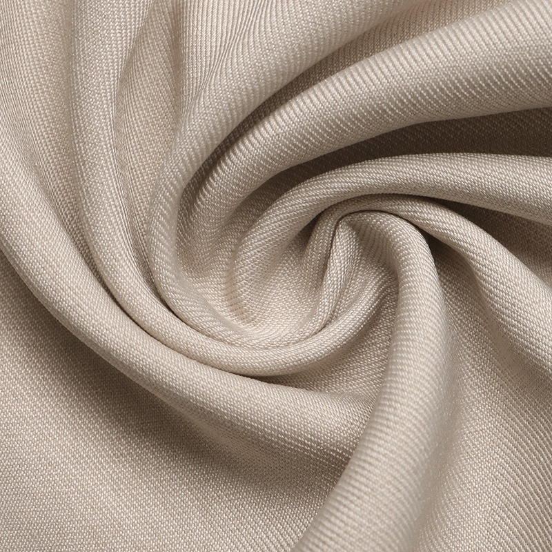 Mono de pierna ancha color beige, confeccionado en mezcla de lino, con tirantes anudados.