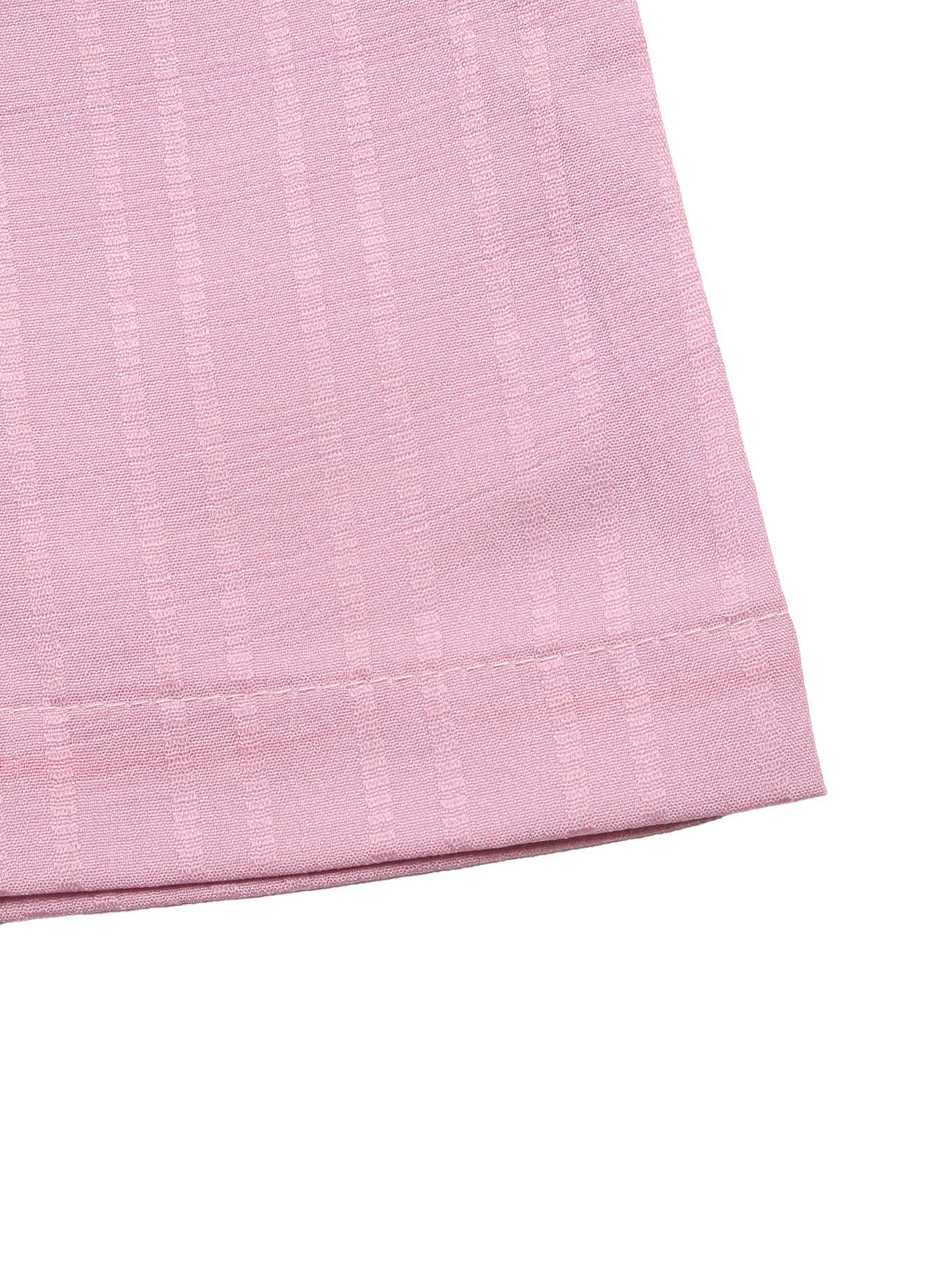 Tuta intera rosa a coste con scollo a V e gamba larga, stampa tie-dye.
