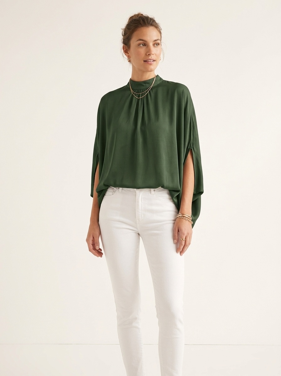 Blusa elegante con manga dolman y cuello simulado