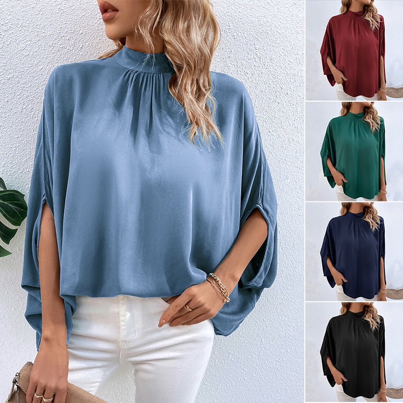 Blusa elegante con manga dolman y cuello simulado