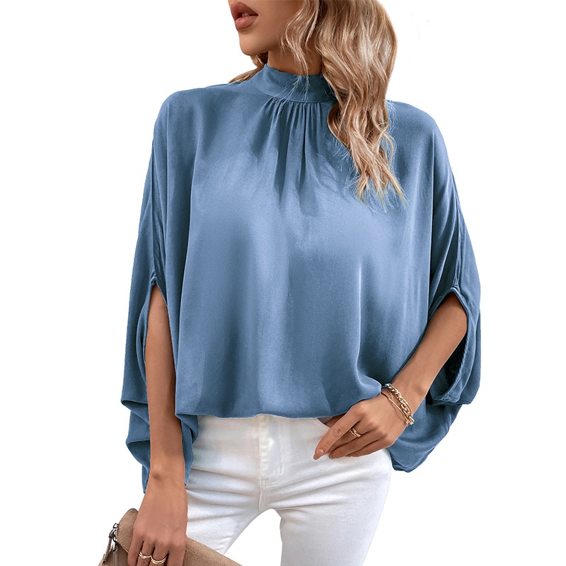 Blusa elegante con manga dolman y cuello simulado