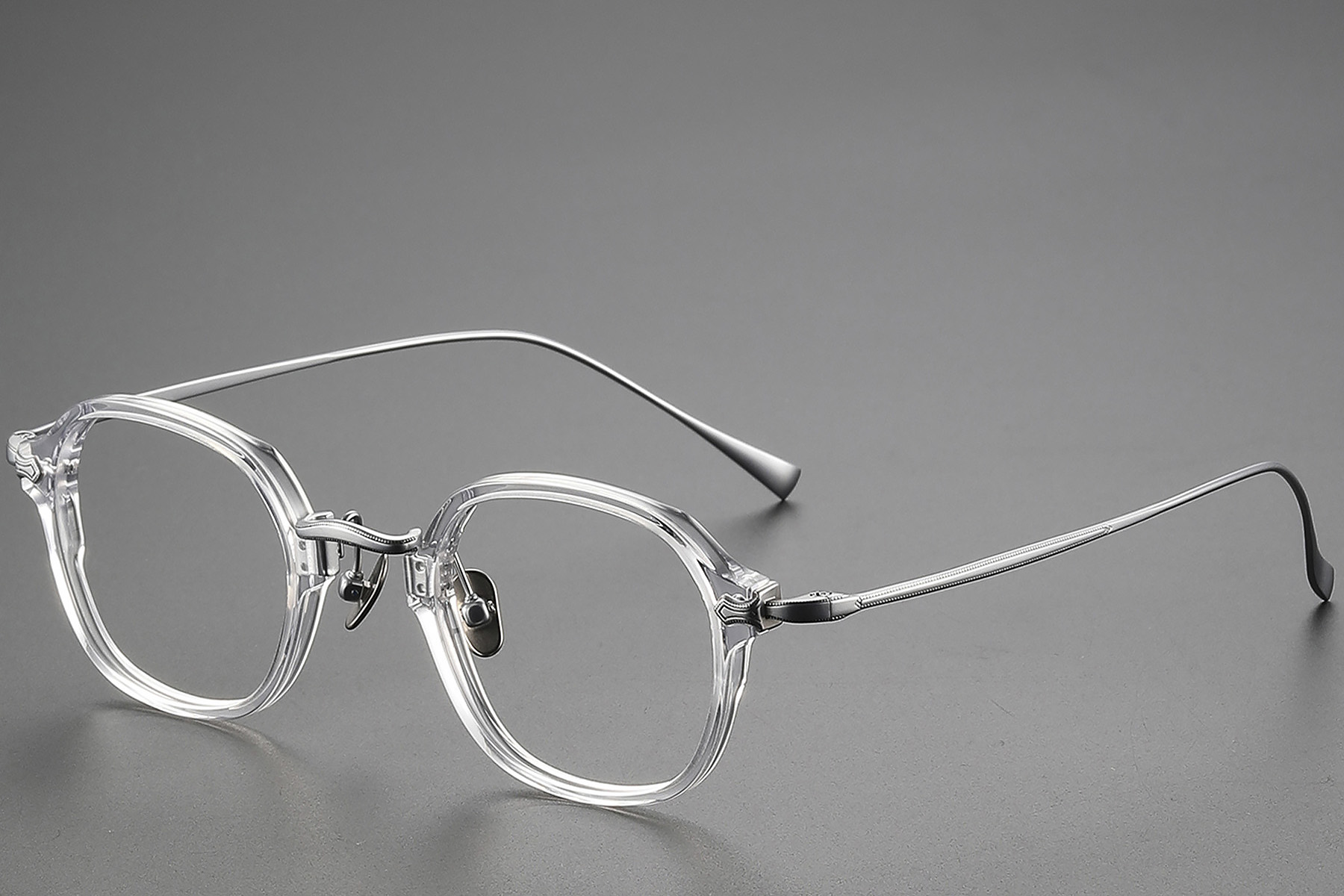 BS1913-0496_Transparent_Oval_Titanium_Glasses_corner