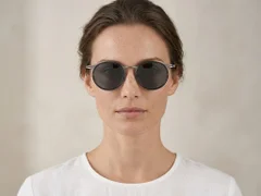 BS1913-0696_Black_Oval_Titanium_sunglasses-tryon_female