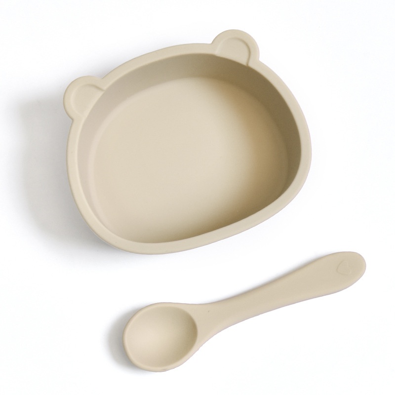 Set di ciotola e cucchiaio in silicone a forma di orsetto per la pappa del bambino.