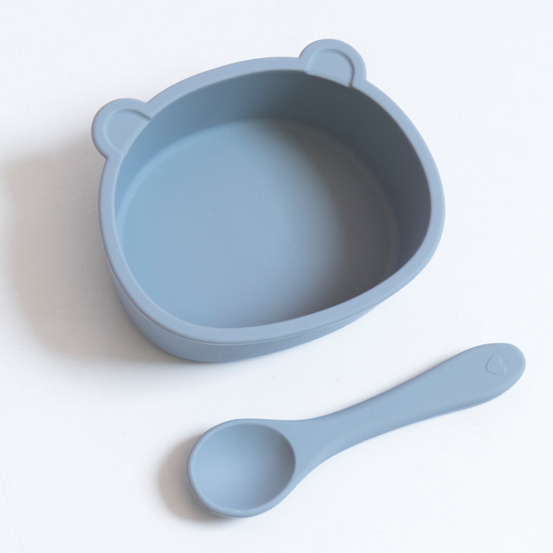 Set di ciotola e cucchiaio in silicone a forma di orsetto per la pappa del bambino.