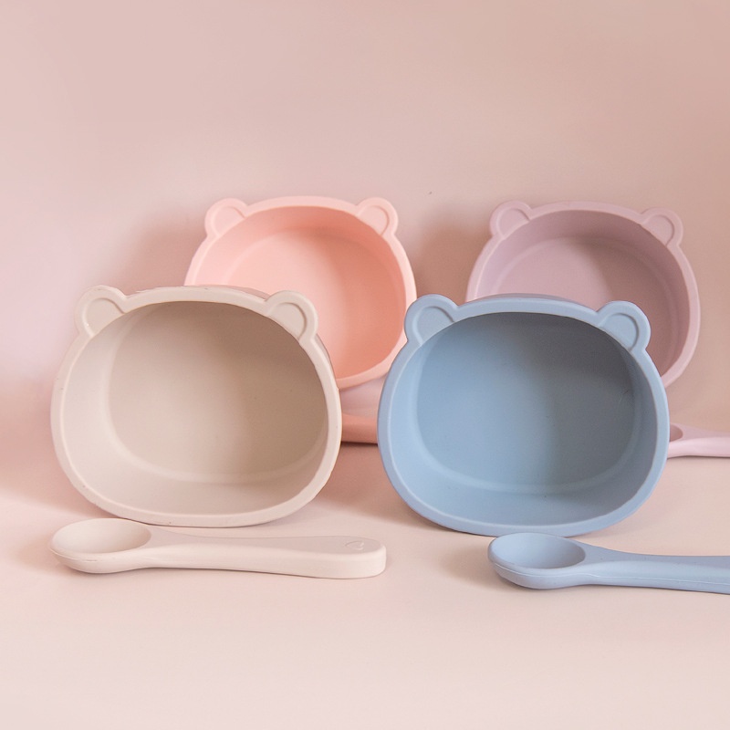 Set di ciotola e cucchiaio in silicone a forma di orsetto per la pappa del bambino.