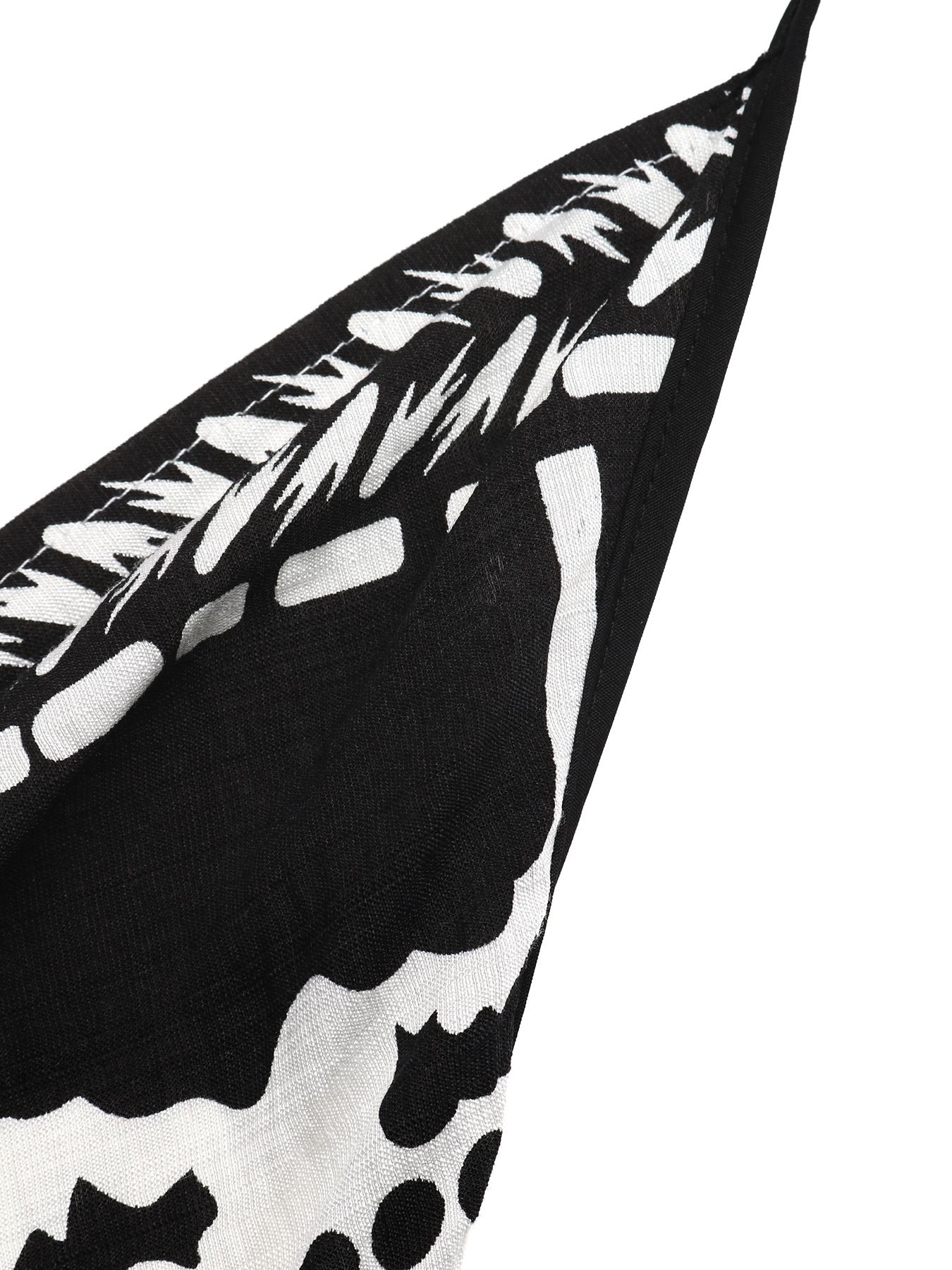 Vestido largo bohemio con cuello halter y estampado floral en blanco y negro