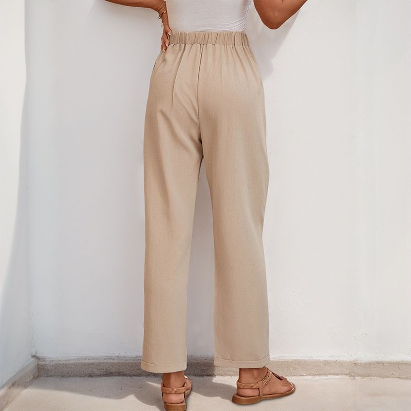 Pantalones casuales plisados de talle alto color beige para mujer
