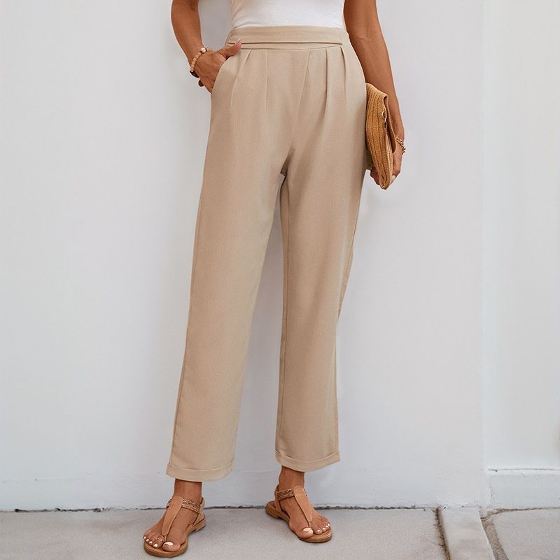 Pantalones casuales plisados de talle alto color beige para mujer