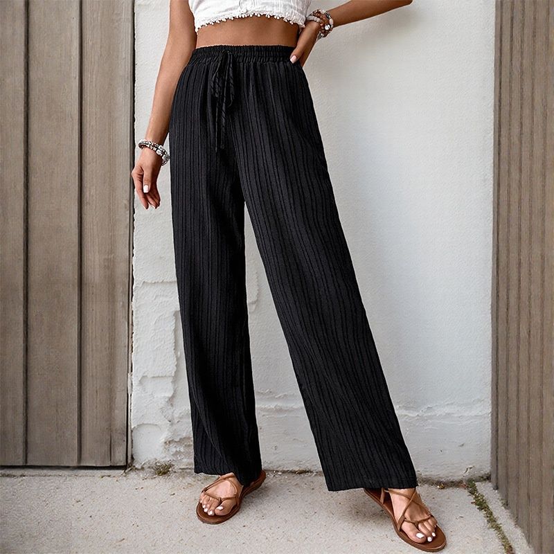 Pantalones de descanso de mujer con pernera ancha acanalada y cordón ajustable.