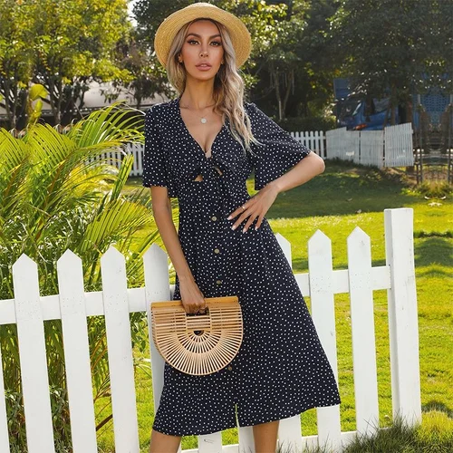 Vestido midi con escote en V y lazo frontal de lunares