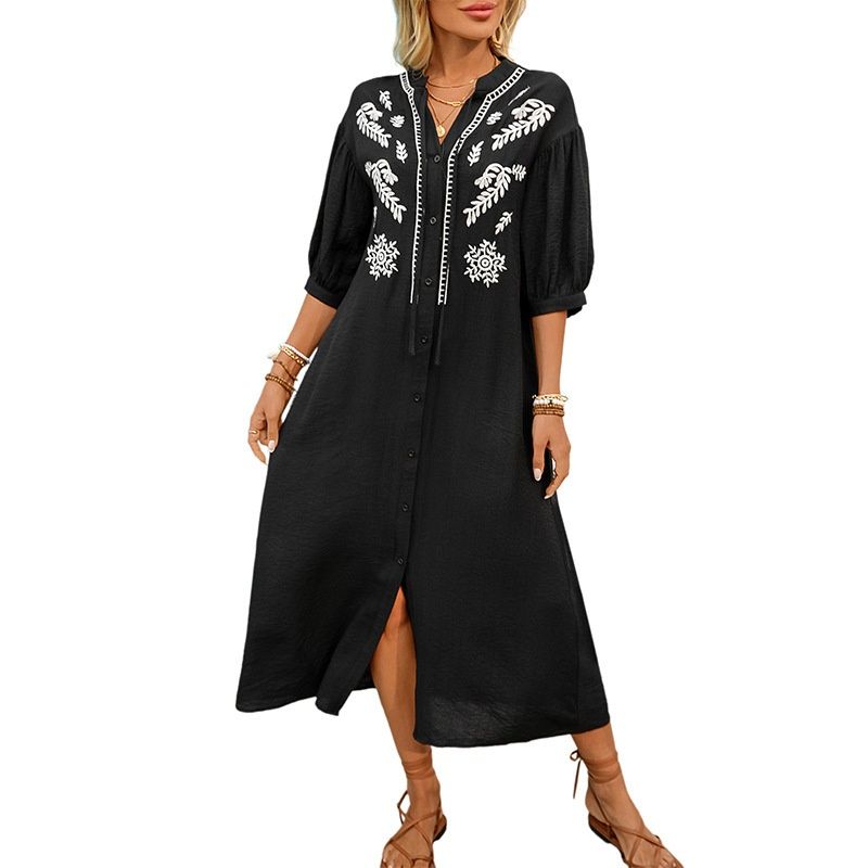 Vestido midi bordado con botones en la parte delantera y mangas abullonadas.