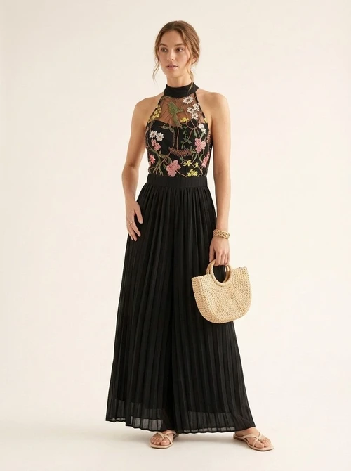 Combinaison noire à fleurs, dos nu, plissée, jambes larges