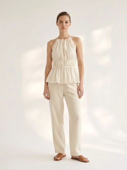Haut péplum froncé à col halter pour femme