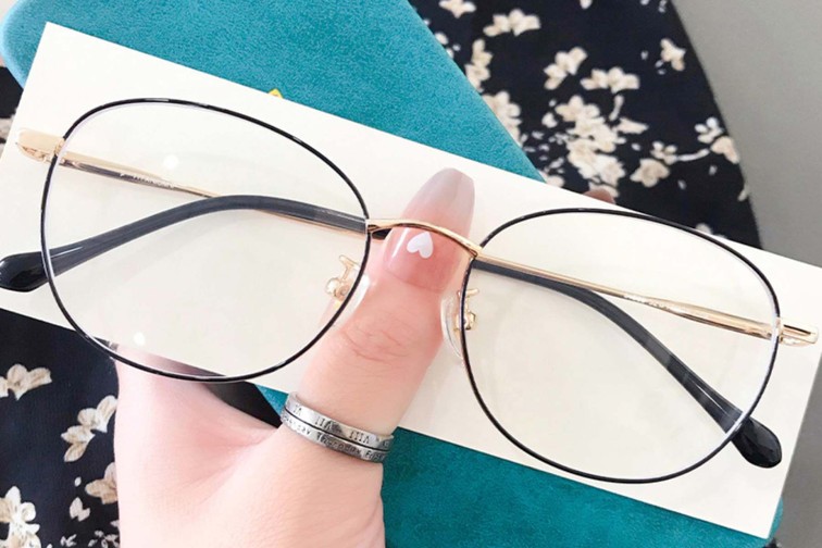 Gafas ovaladas de titanio dorado #BS0406-0331