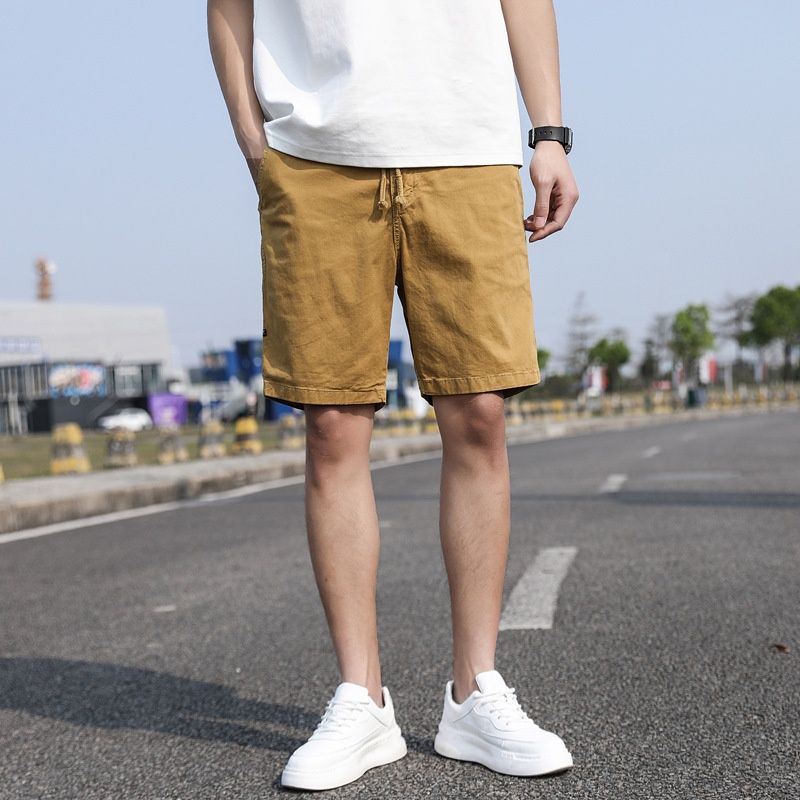 Pantalones cortos cargo vintage de corte relajado para hombre, ideales para actividades al aire libre en verano.