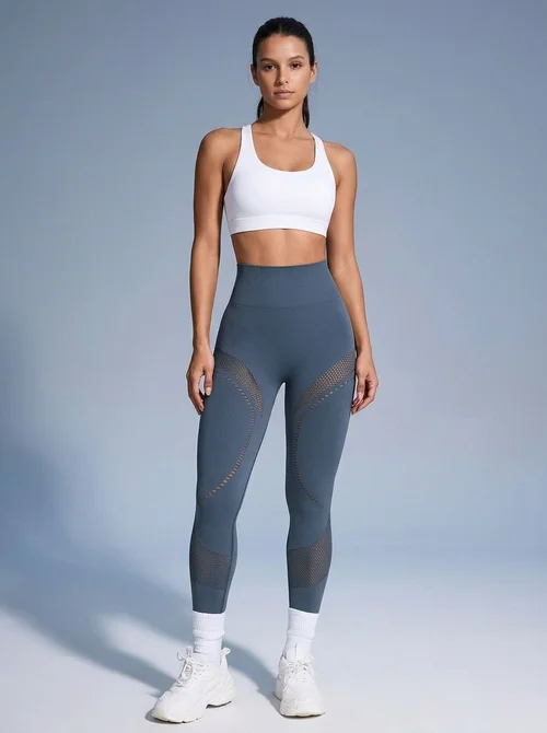 Pantaloni da yoga traspiranti a vita alta da donna, con design a incavo e vestibilità snellente che modella i fianchi.