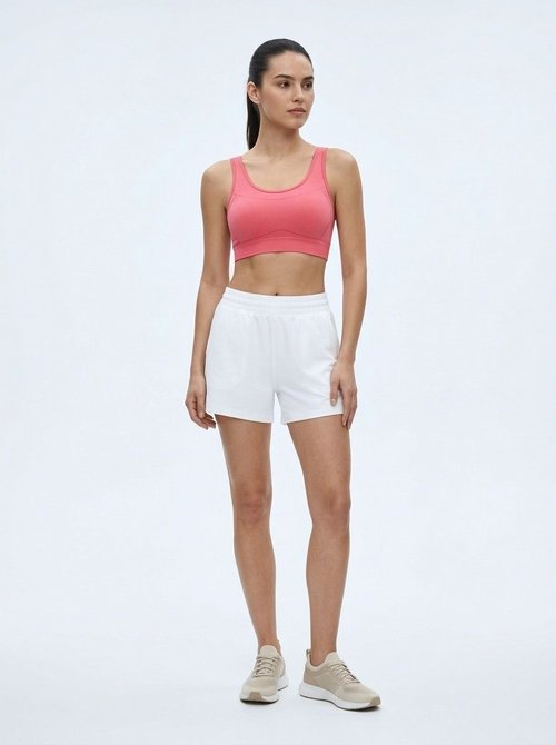 Sujetador de yoga sin aros con absorción de impactos y soporte transpirable que estiliza la figura para mujer.