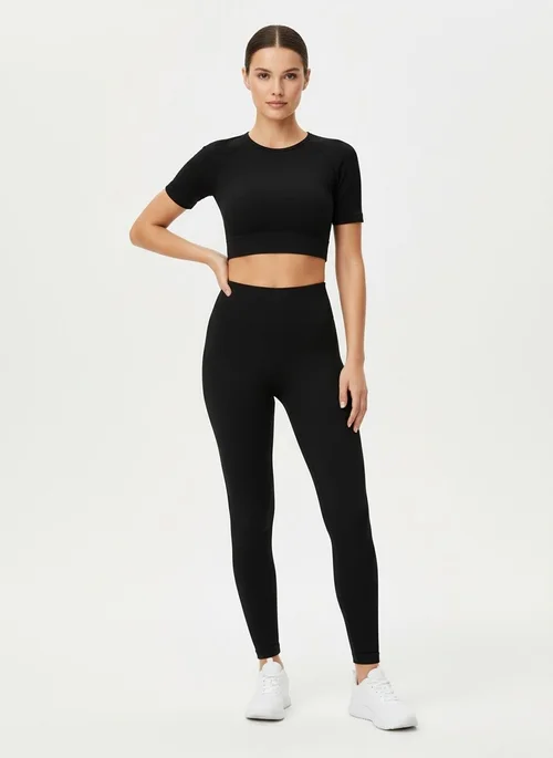 Nauwsluitend cropped, sneldrogend yoga-shirt met middellange mouwen en S-vormige pasvorm voor dames