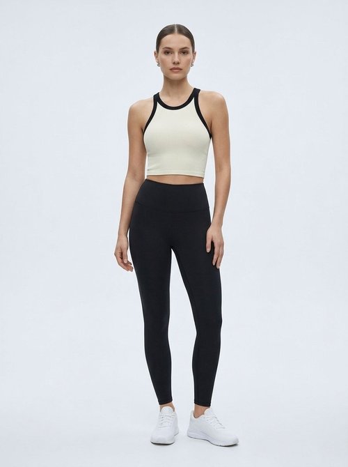 Top corto ajustado de talle alto, secado rápido y color block para mujer (sin relleno)