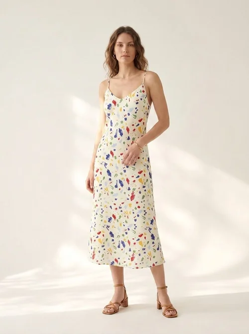 Elegante abito sottoveste midi con stampa astratta e laccetti sul retro.