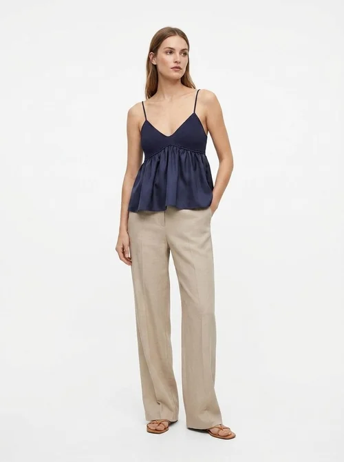 Top a canotta blu navy a coste con scollo a V e volant