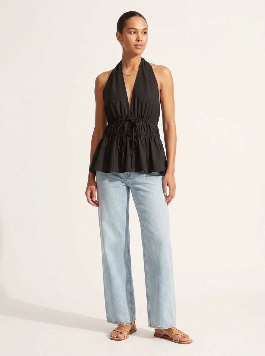 Elegante top peplum con scollo all'americana e coulisse in vita