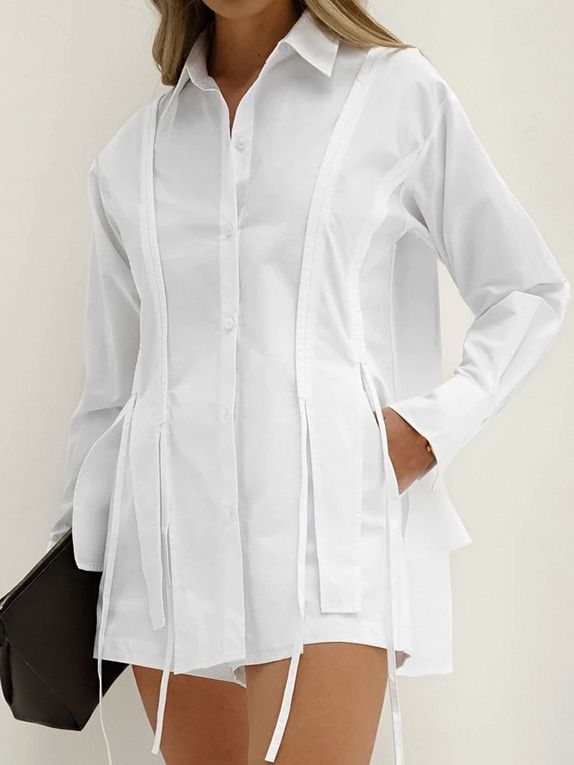 Camisa blanca de manga larga con botones y detalle de lazo para mujer