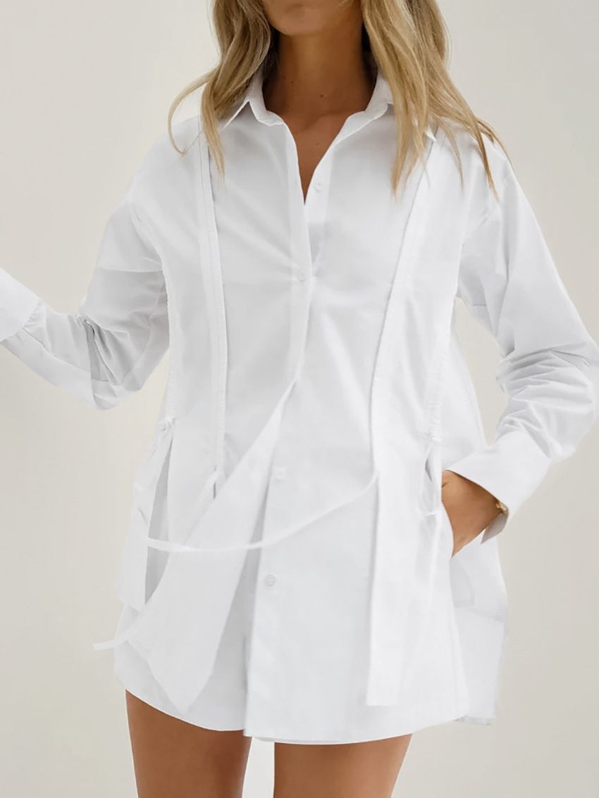 Camisa blanca de manga larga con botones y detalle de lazo para mujer