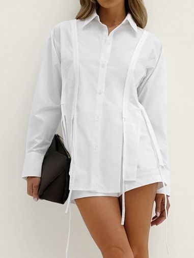 Camisa blanca de manga larga con botones y detalle de lazo para mujer