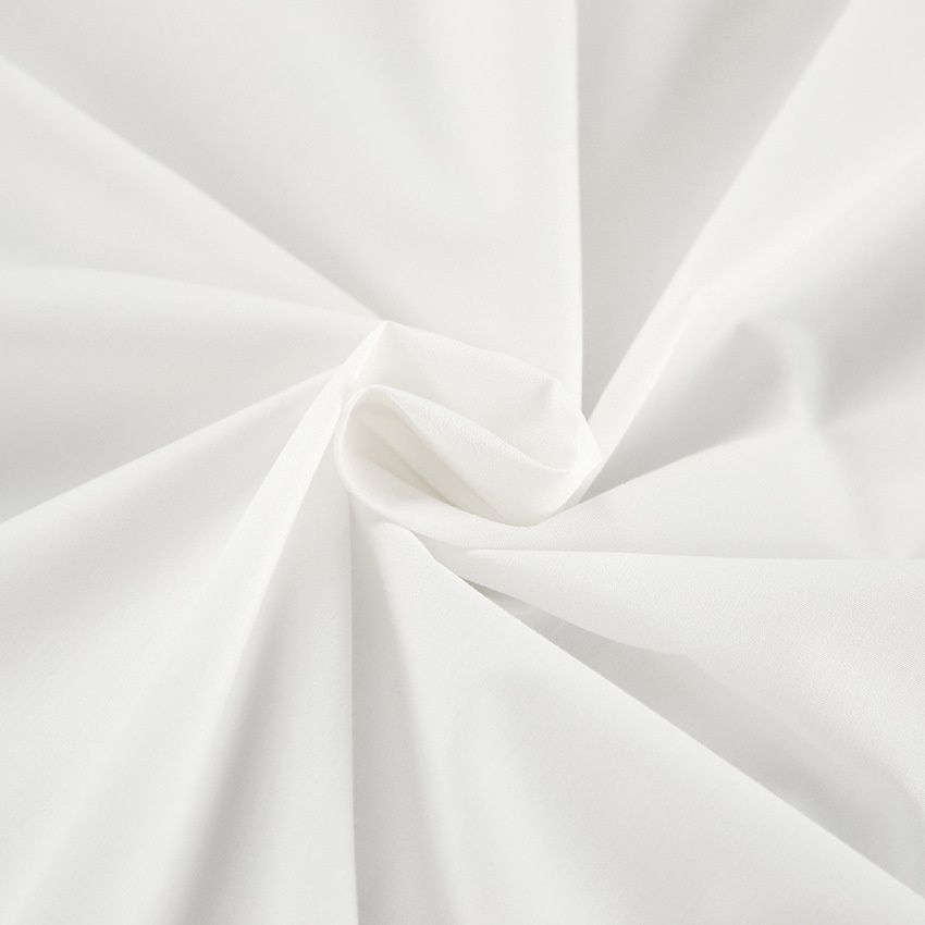 Camisa blanca de manga larga con botones y detalle de lazo para mujer