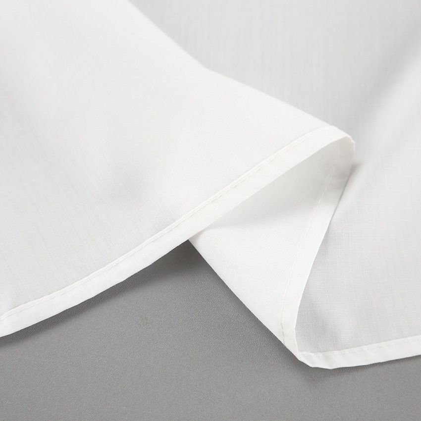 Camisa blanca de manga larga con botones y detalle de lazo para mujer