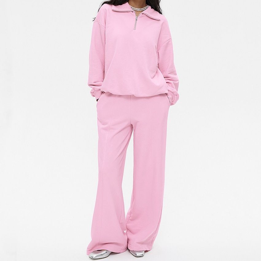 Conjunto de sudadera con cremallera hasta el cuello y pantalón de pierna ancha para mujer.