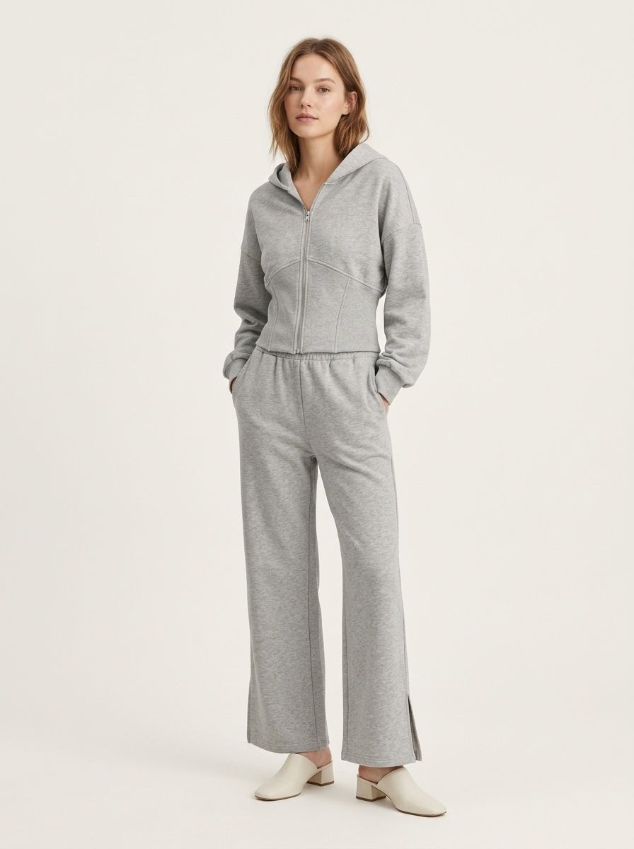Completo composto da felpa con cappuccio a corsetto e pantaloni a gamba larga color grigio melange