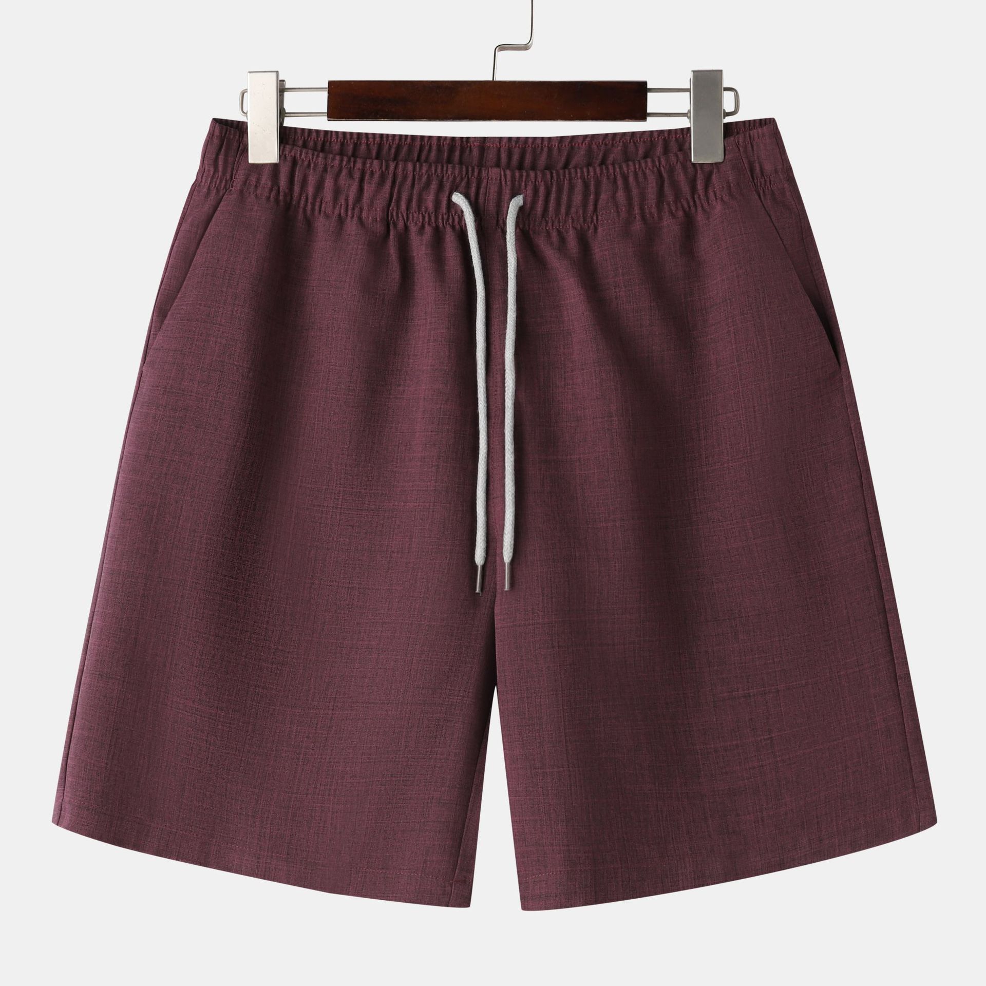 Conjunto de camisa y pantalones cortos de manga corta con cuello alto de color liso para hombre de principios de verano