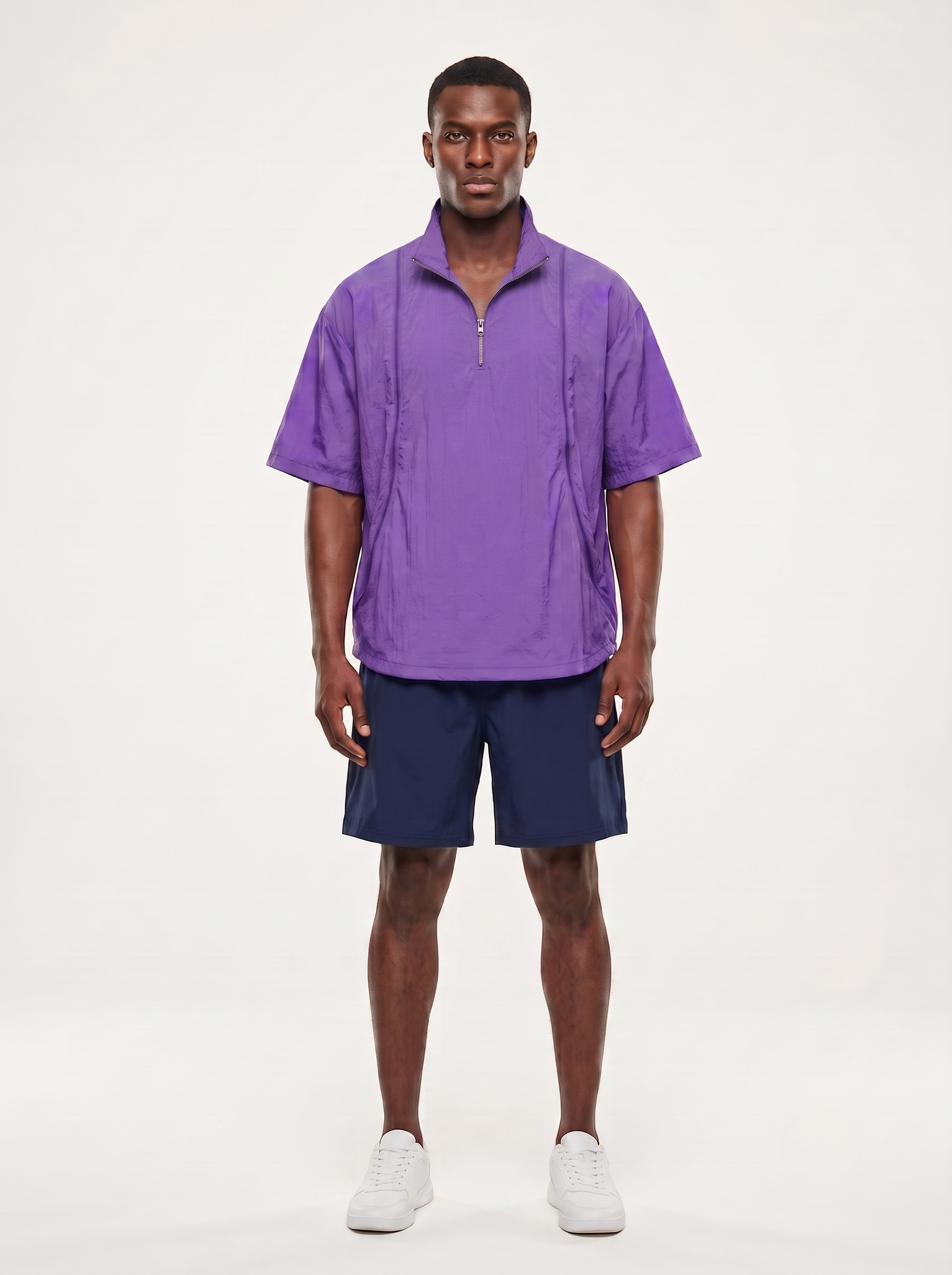 Poncho deportivo unisex ligero con media cremallera.