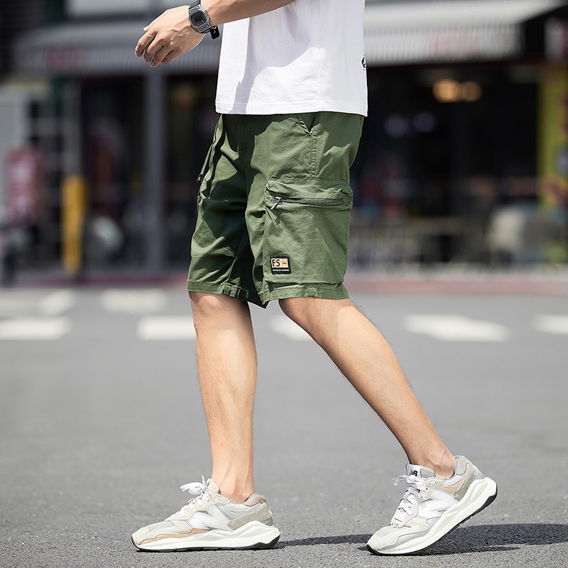 Pantalones cortos cargo vintage de corte holgado con múltiples bolsillos para hombre, ideales para uso informal.