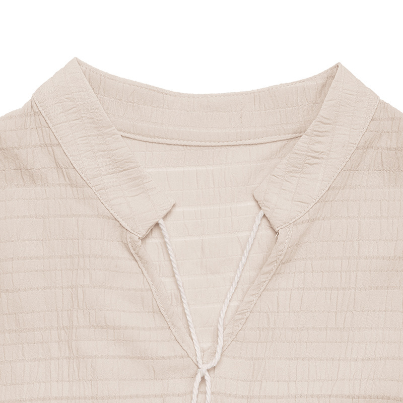 Robe midi bohème sans manches à volants et col à pompons